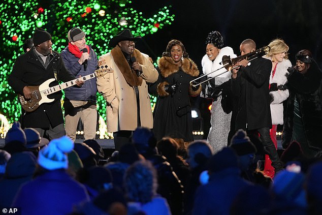 James Taylor (second from left) was among the performers who took the stage