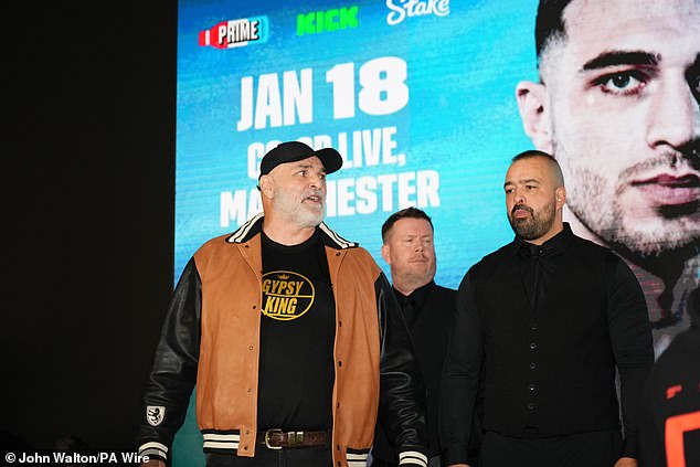 John Fury was seen throwing water in the direction of the former UFC star during the pre-fight press conference last month.