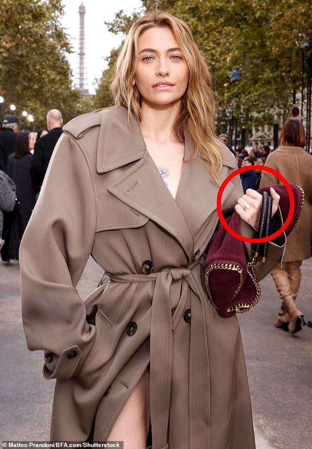 While she didn't specify when or where Justin popped the question, she was seen wearing the ring in September (pictured at Paris Fashion Week).