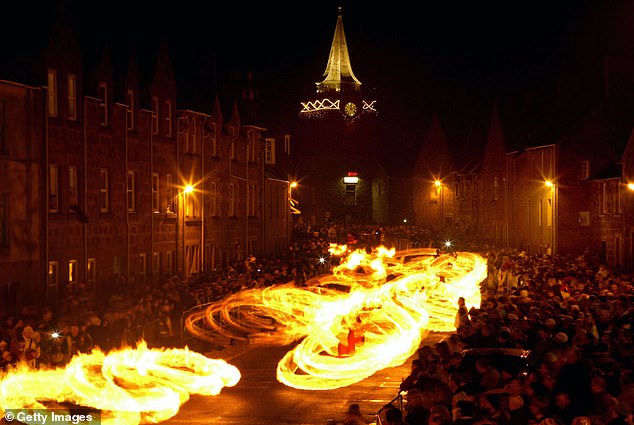 Dramatic: In Stonehaven, the new year is seen with swinging flaming balls