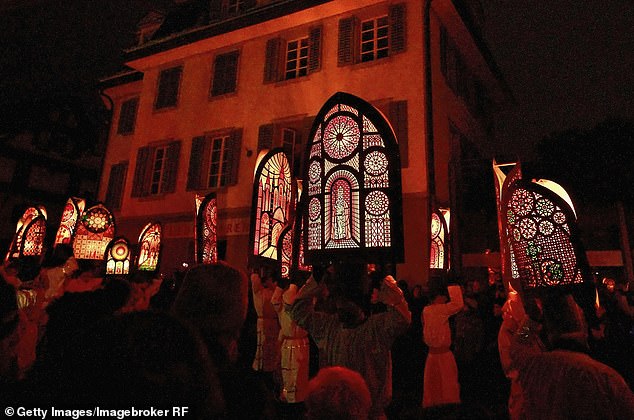 Huge bishops' miters are displayed at the St. Nicholas Day parade in the Swiss town of Küssnacht