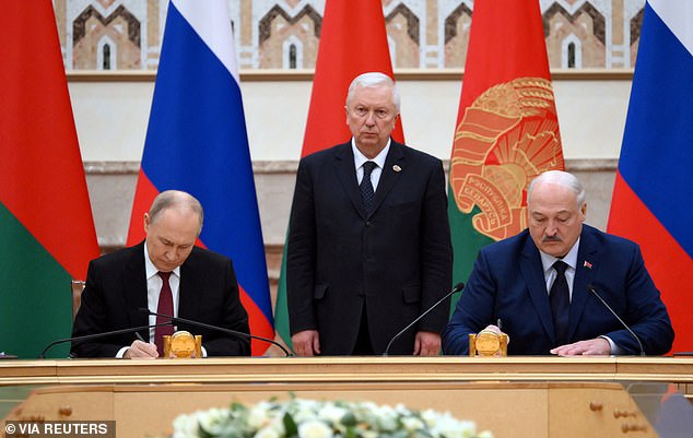 Russian President Vladimir Putin and Belarusian President Alexander Lukashenko take part in a signing ceremony following a meeting of the Supreme State Council of the State of the Union of Russia and Belarus in Minsk, Belarus, December 6, 2024.