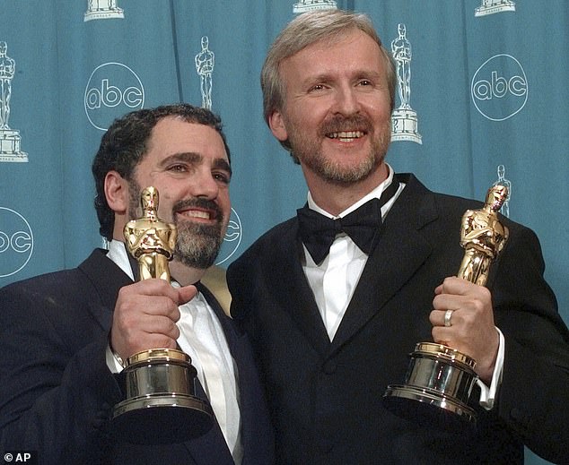 The actress, 75, who worked with the Canadian filmmaker on both Avatar and Aliens admitted that the best way to work with him is to do everything he tells you (James (R) and Jon Landau (L) pictured winning an Oscar for Titanic in 1998. )