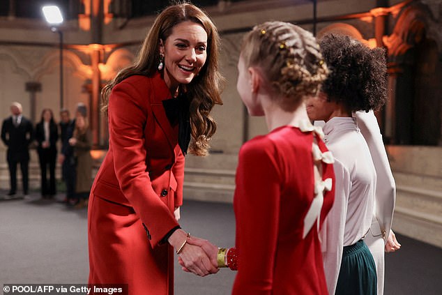 Kate's red double-breasted double-breasted coat is a custom-made design by the British fashion house.