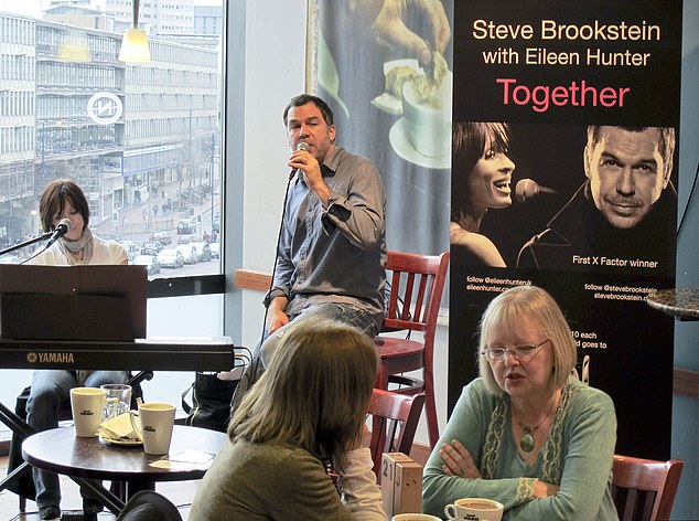 Steve pictured performing at a local Caffe Nero in Birmingham alongside his wife Eileen.