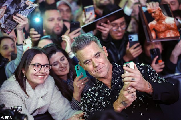 Robbie Williams took selfies with fans on the red carpet last week to celebrate his new biopic, Better Man.