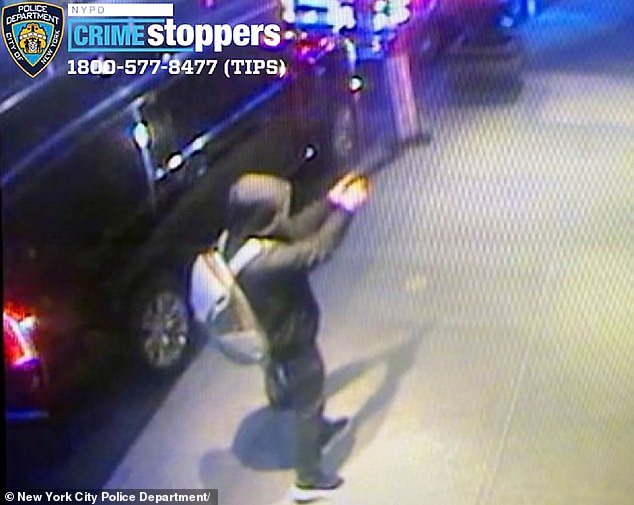 A CCTV image shows the gunman approaching Thompson and shooting him from behind.