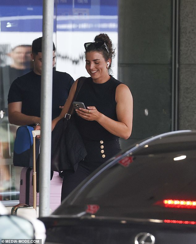 Jessica appeared to be in good spirits as she flashed a smile upon her return to Australia and waited for her vehicle outside the airport terminal.