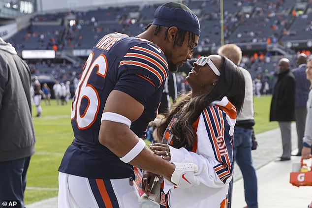 The gymnastics legend is pictured with NFL husband Jonathan Owens before a Bears game