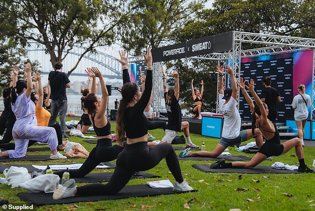 The crowd seemed to appreciate Kayla and Katie's instructions, happily engaging in lunges and stretches as the duo watched from the stage.