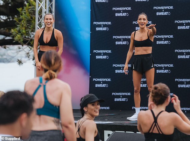 The entrepreneur completed her sporty look with a pair of sneakers and white socks as she and Katie prepared to show off their physical prowess during class.