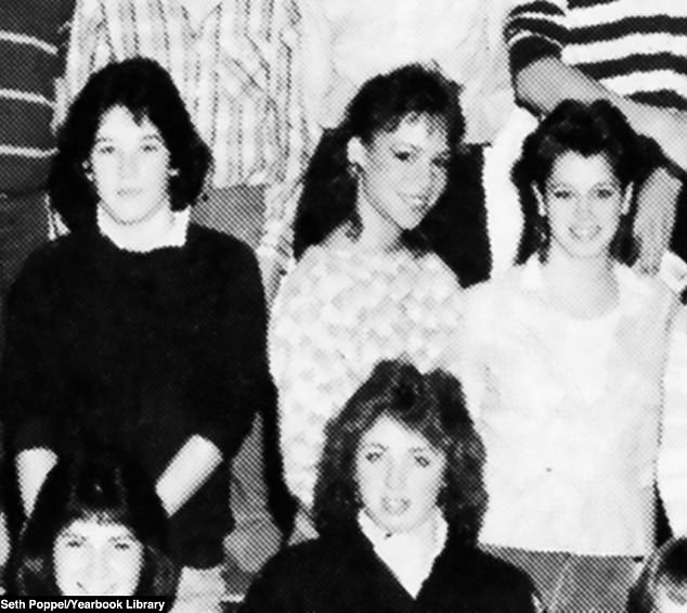 An elegant Mariah flashes a shy smile in a class photo taken in 1985.