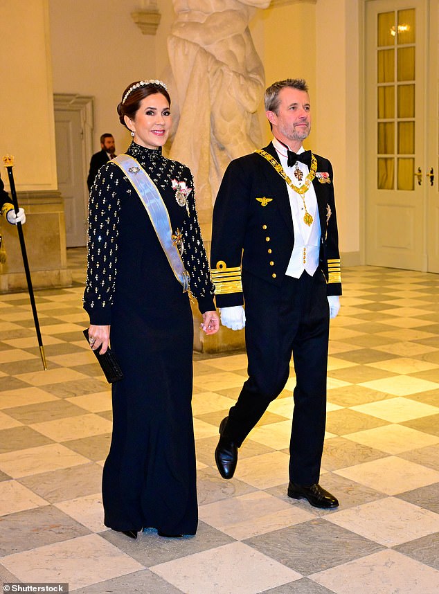 The Queen of Denmark also wore a light gray silk sash and several medals and brooches.