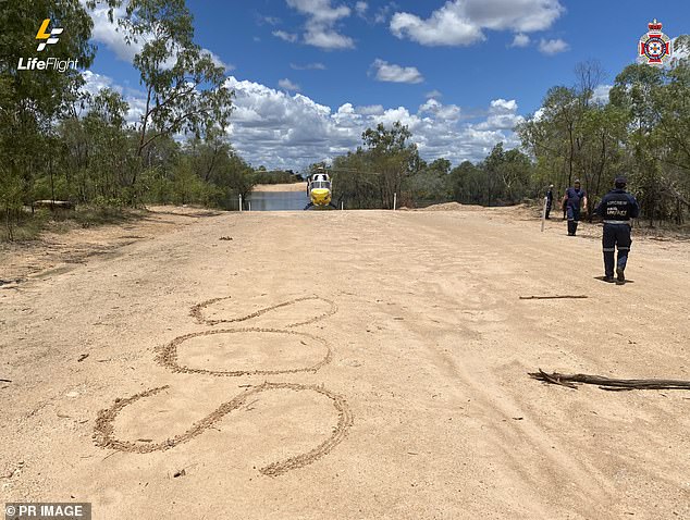 The couple went three days without food, drinking only river water in 40C heat while being chased by a giant crocodile before rescuers found them thanks to their large SOS signs.