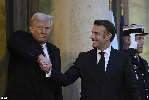 Donald Trump awkwardly shook the hand of the president of France during a visit to Paris to celebrate the reopening of Notre Dame.