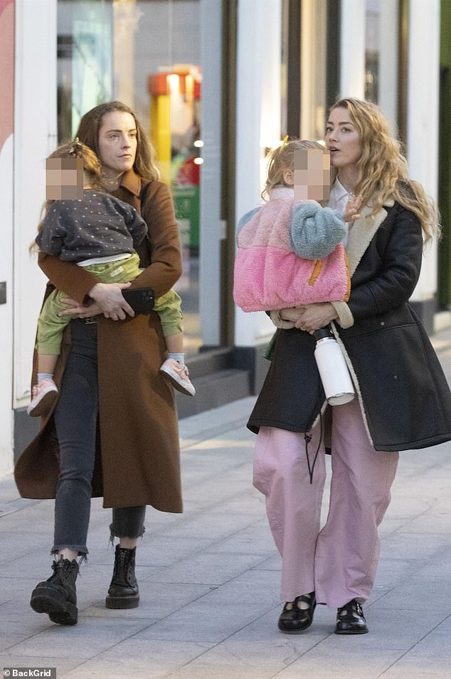 Mother and daughter were briefly joined by a friend who was also shopping with her little one