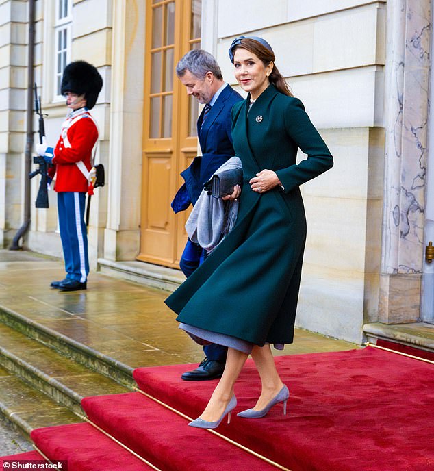 She completed the sophisticated ensemble with gray heels, a matching fascinator, and a clutch.