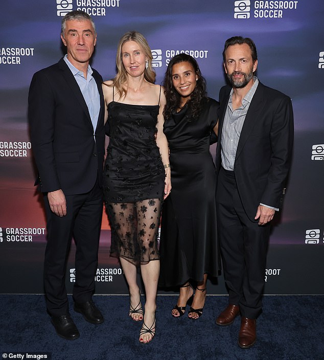 Shue, 57, and Fiebig, 47, appeared to be on a double date as they posed on the red carpet for a group photo with Tommy and Susanna Clark.