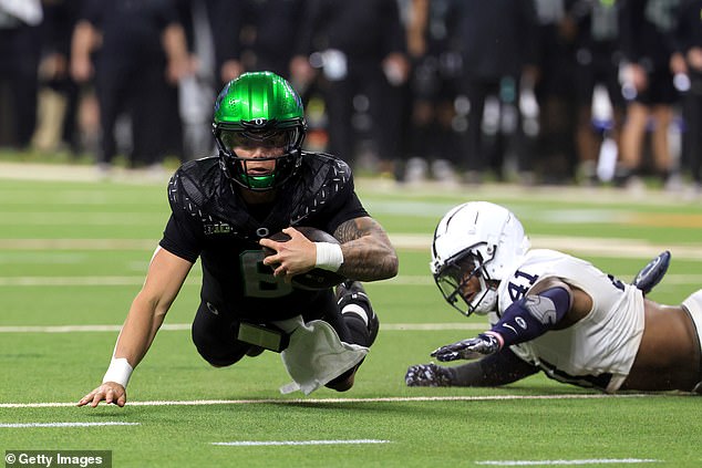 King confronts Oregon Ducks quarterback Dillon Gabriel during the Big Ten Championship game