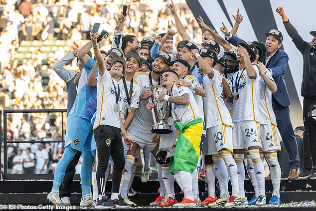 Riqui Puig takes a selfie with the MLS Cup Trophy after the MLS Cup final