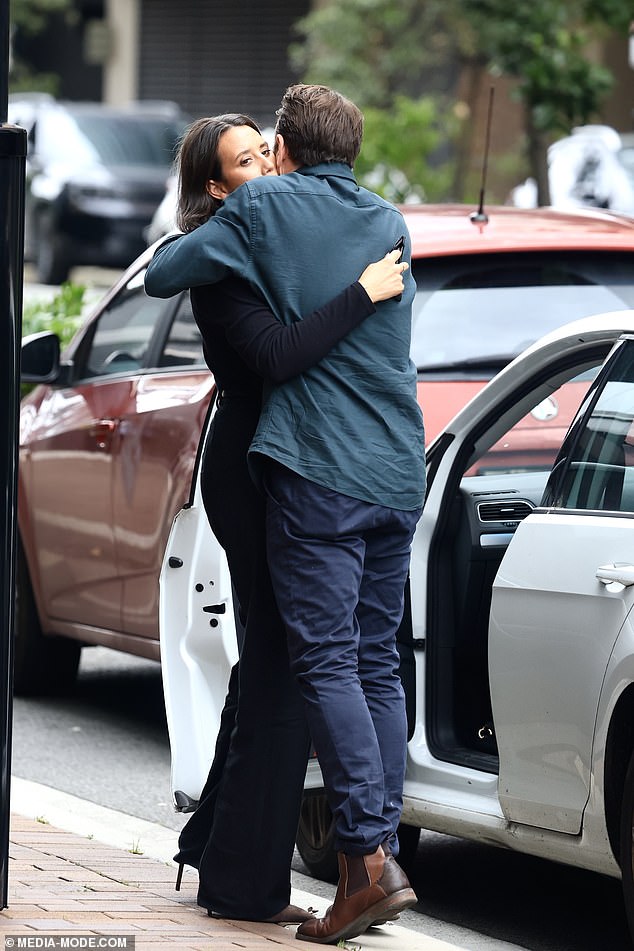 The breakfast host, 41, received a comforting hug from his wife, Kendall Bora, who was waiting outside. Both in the photo