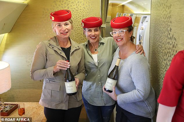 Deborah (center) and two guests have fun posing as Emirates cabin crew