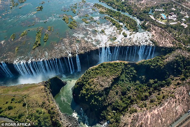 Guests arrive at Victoria Falls Bond style in four helicopters.