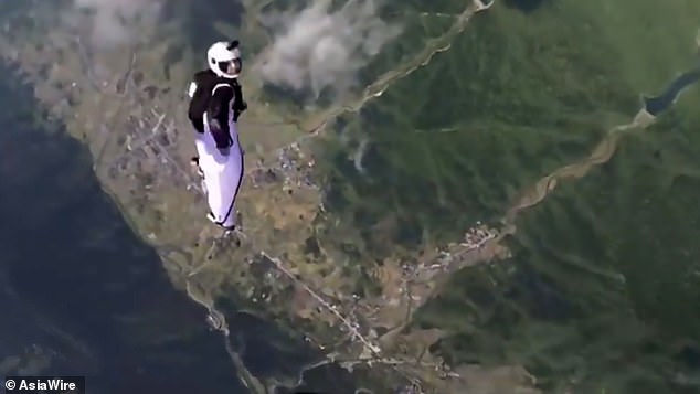 A female Wingsuit flyer's final moments in China were captured by a cameraman who jumped out of the helicopter with her