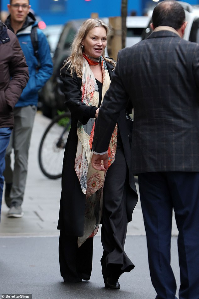 1733652867 468 Kate Moss looks chic in a black coat and 90