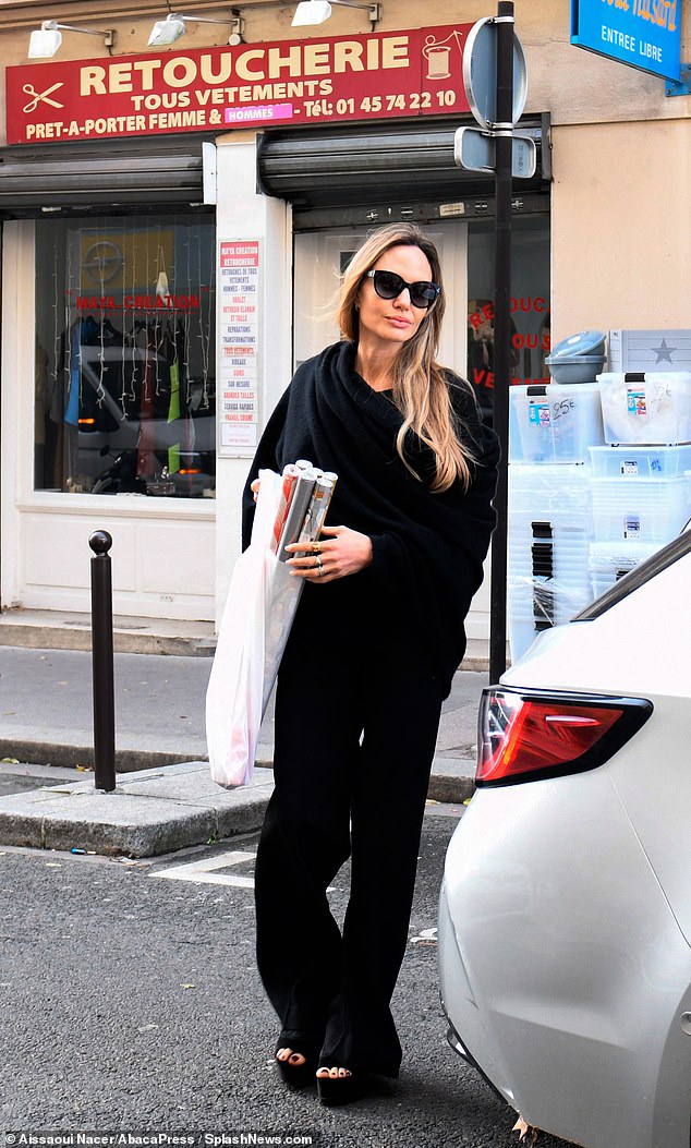 While out shopping, the star could be seen stocking up on her festive wrapping paper as she left a store in the capital with six rolls.