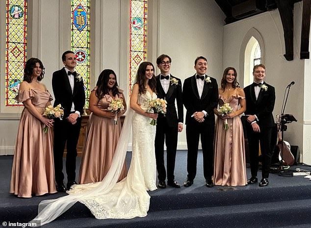 The bride carried a bouquet of cream and pastel orange flowers.