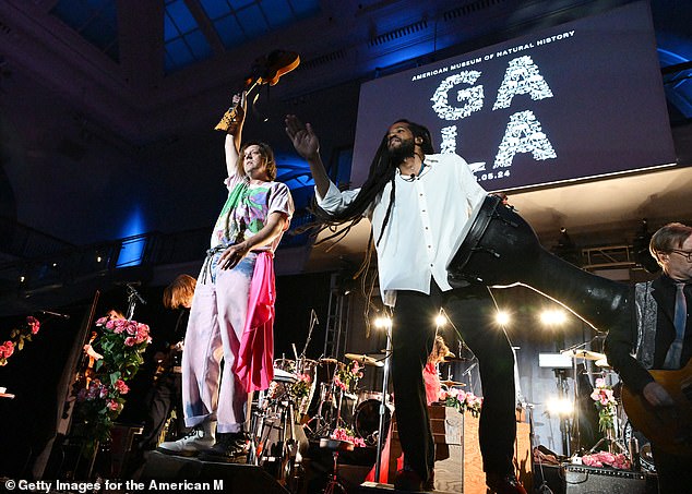 Arcade Fire's Win Butler and Paul Beaubrun perform on stage