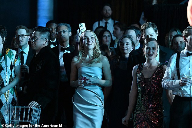 Chloe Fineman (centre) was all smiles at the gala - until her dress split open