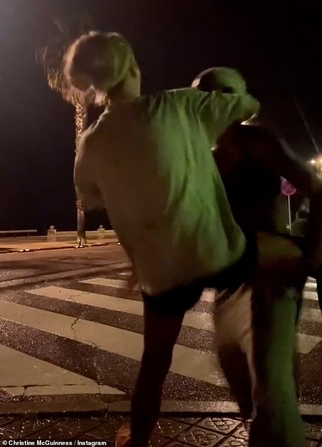 Christine also shared a clip of her dancing in the street while wearing a brightly colored jumper and shorts.