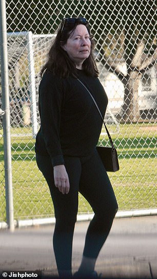 Linda was dressed in a black top and leggings with Nike sneakers