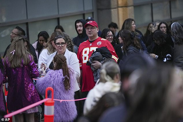 A man wearing a Kelce Chiefs jersey lines up outside BC Place for the final run of the tour