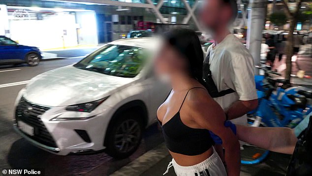 Among those arrested was a woman in Sydney's CBD who was dragged into the back of a police van while wearing a revealing outfit.