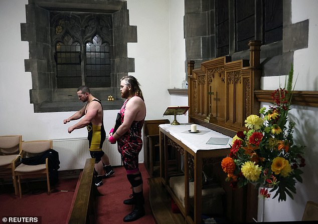 Wrestlers wait to have their portraits taken at St Peter's Church in Shipley.