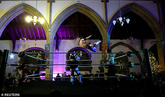 Wrestlers Gareth Angel and Jimmy Jackson competing in the church ring.