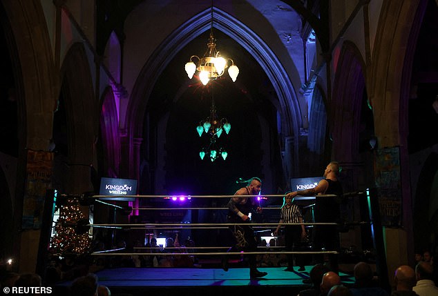 Wrestlers compete during the Kingdom Wrestling Toyal Rumble at St Peter's Church in Shipley.