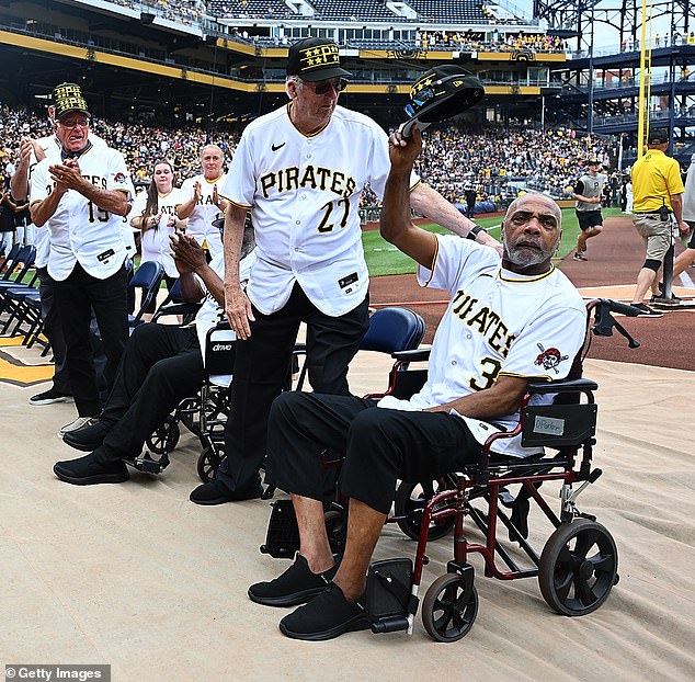 Parker tips his hat to the crowd during a ceremony honoring the 1979 World Series winners