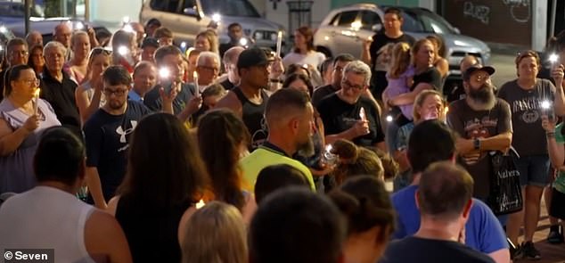 Hundreds of locals left flowers outside the couple's burger joint during a candlelight vigil (pictured) at the weekend and remembered how they gave free food to penniless customers.