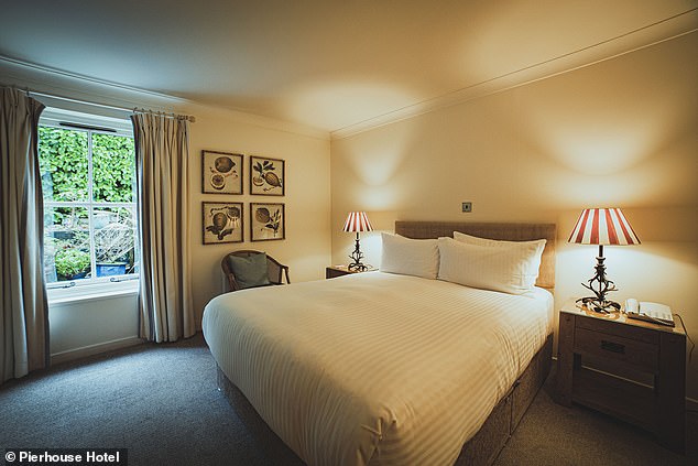 Upstairs is a bedroom in the Pierhouse Hotel. Peak season overnight stays start at £200