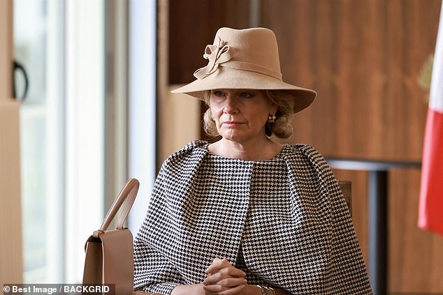 Mathilde looked typically elegant in a black and white coat