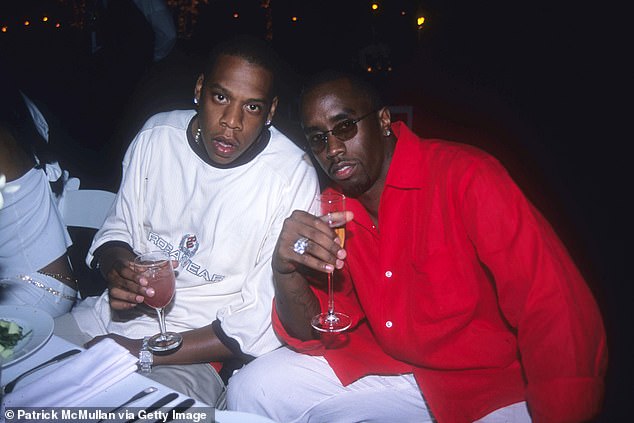 Jay-Z has been unmasked as the mystery celebrity accused of gang-raping a 13-year-old girl with Diddy at a 2000 VMAs after-party, according to a lawsuit. (Pictured: Jay-Z and Sean Combs at Puffy's 4th of July party at Sean Combs' house on July 2, 2000)