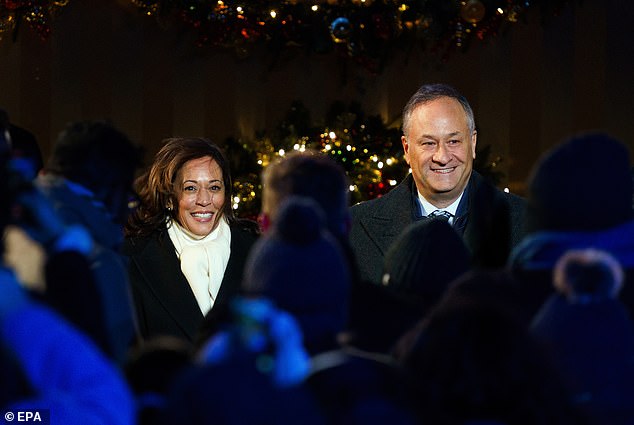 US Vice President Kamala Harris (L) and Second Gentleman Doug Emhoff (R) attend the lighting of the National Christmas Tree on the Ellipse