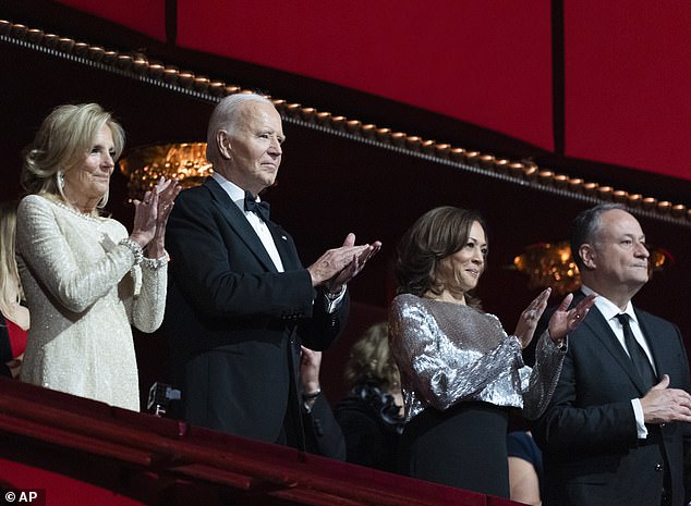 President Joe Biden, second from left, first lady Jill Biden, left, Vice President Kamala Harris and Second Gentleman Doug Emhoff, right, applaud during the 47th Kennedy Center Honors