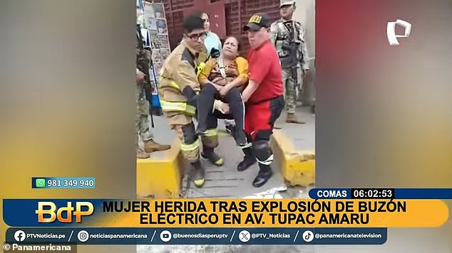 Elvira Taipe is carried away by first responders moments after she stepped on the concrete cover of an underground sidewalk electrical box that exploded in Lima, Peru, last Thursday.