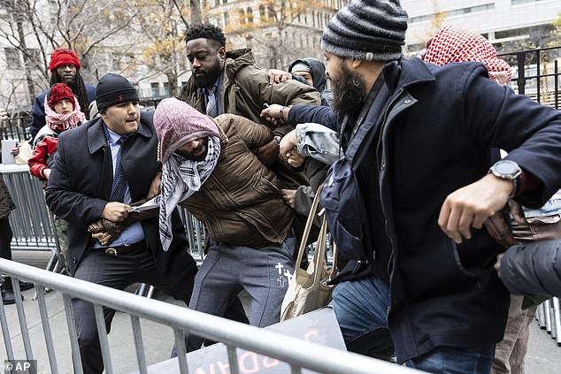 It is truly heartening to see this jury, despite hearing racially charged chants from outside protesters, return a fair verdict. (Pictured: A person protesting the not guilty verdict was arrested outside the Manhattan courthouse.)