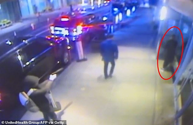 Footage of the attack shows a figure, who appears to be a woman dressed in dark clothing and holding a cup of coffee, fleeing from a door as the killer opens fire a few meters away.